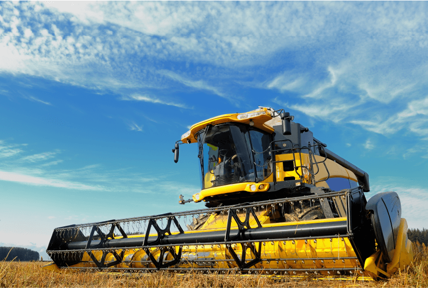 Yellow New Holland Combine in a Field